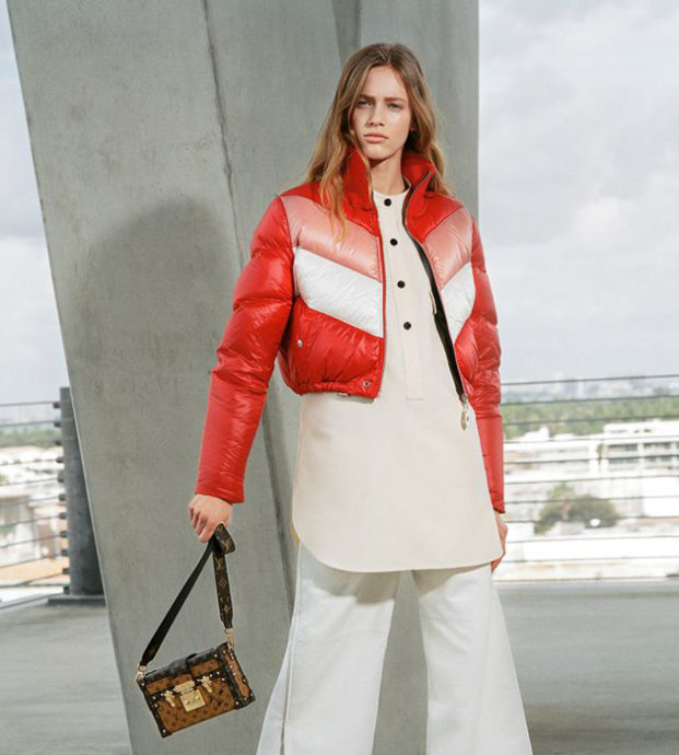 A Woman in Red Blazer and Pants Holding a Louis Vuitton Bag · Free Stock  Photo